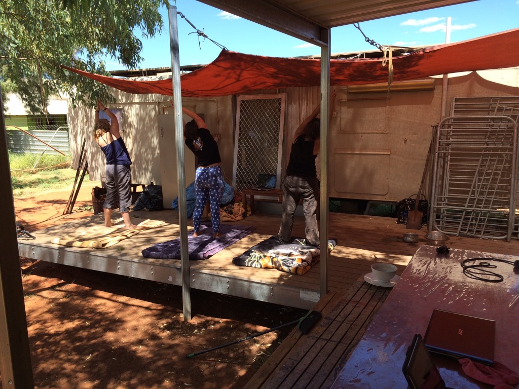 Volunteers try a little yoga at the donga